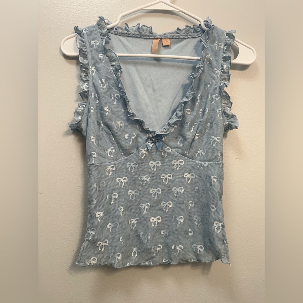 Blue Sleeveless Top with Bow Pattern